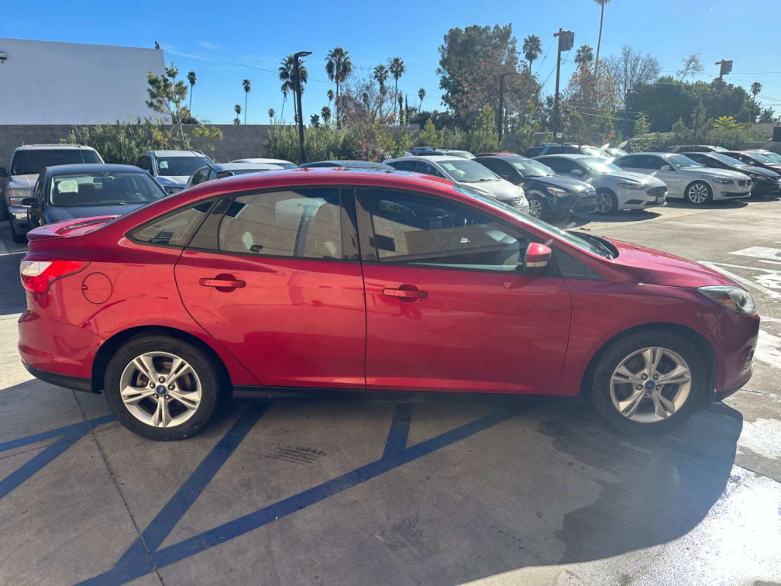 2012 RED /BLACK Ford Focus SE Sedan (1FAHP3F29CL) with an 2.0L L4 DOHC 16V engine, AUTOMATIC transmission, located at 30 S. Berkeley Avenue, Pasadena, CA, 91107, (626) 248-7567, 34.145447, -118.109398 - New Tires! Nice Interior! drives and looks good! Bad credit? We can help! We are the bank. All our cars are thoroughly inspected and reconditioned by our technicians. FREE CARFAX report. Stop by or call to speak with our friendly staff. Whether you have bad credit, no credit, bankruptcy, or reposse - Photo #5